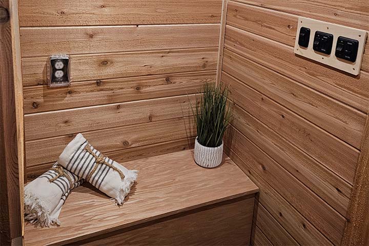 The interior of a Minnesota Mobile Sauna is lined with cedar boards.
