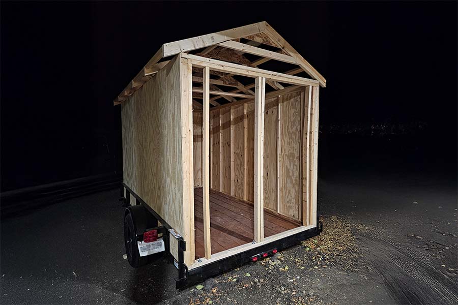 A night image of a Minnesota Mobile Sauna being built.